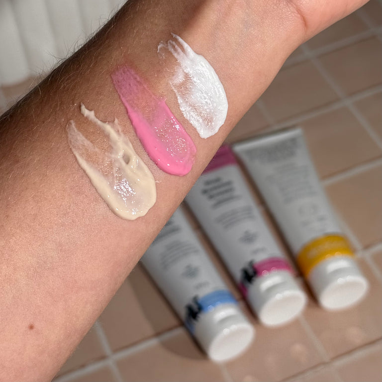 MooGoo Eczema and Psoriasis Cream Marshmallow Elderberry, Eczema and Psoriasis Cream Gotu Kola Chamomile, and Pink Eczema Cream Vitamin B12 swatches on wrist, soothing cream for sensitive eczema and psoriasis prone skin