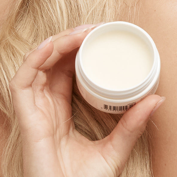 MooGoo Shea Sorbet Vanilla Butter Balm held in hand, natural skincare for chapped and cracked skin patches