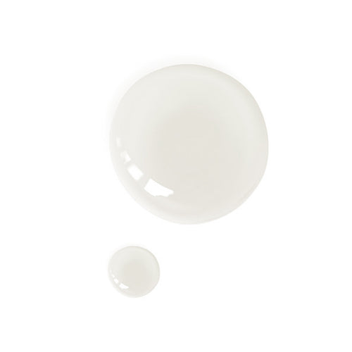 Halved coconut with Coconut Oil