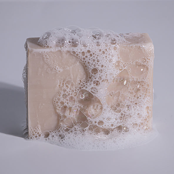 MooGoo Buttermilk Soap Bar stacked with other bars, natural hydrating cleanser for dry skin, free from SL