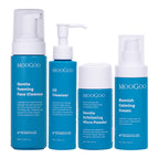 Four MooGoo skincare products in blue and white packaging, including Gentle Foaming Face Cleanser, Oil Cleanser, Exfoliating Micro Powder, and Blemish Calming Cream, arranged against a plain white background. Complete gentle skincare routine for blemish or acne prone skin. 