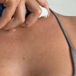 Female applying MooGoo Skin Hero Body Oil to chest and rubbing in. With 6 hero nourishing oils to instantly replenish, soften and hydrate dry skin. Lightweight, Fast-Absorbing & Ideal for Pregnancy & Postpartum Skincare