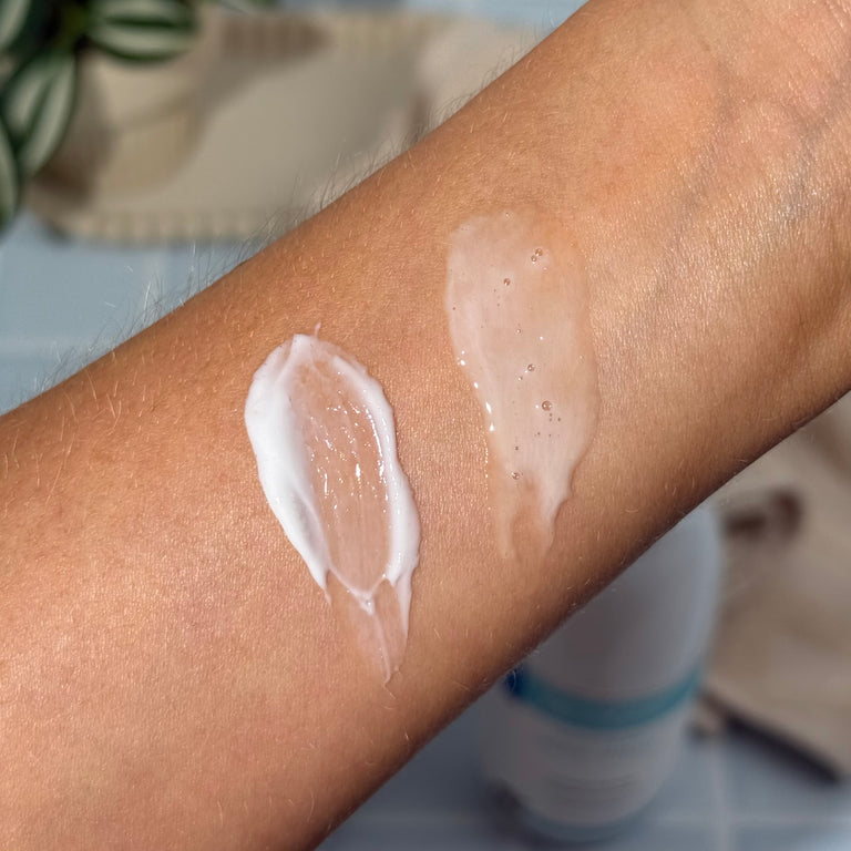 Swatch of MooGoo Milk Wash and MooGoo Fast Hydrating Lotion on a person's arm with a blurred background