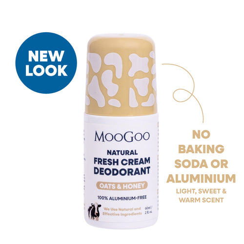 MooGoo Natural Fresh Cream Oats & Honey deodorant roll-on bottle with a beige and white cow-print cap, shown on a white background with a blue 'NEW LOOK' badge and product feature text. Aluminium and Baking Soda Free. Light, sweet and warm oats and honey scent. Gentle alkaline formula to prevent odour. 