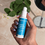 MooGoo Vitamin C Brightening Active Serum bottle in hand, natural vitamin C formula targeting pigmentation, discolouration and sun damage.