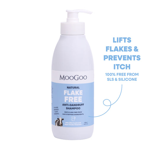 MooGoo Natural Flake Free Anti-Dandruff Shampoo in a white pump bottle with a blue label, shown on a white background. Lifts flakes and prevents itch. Free from SLS, SLES and Silicones. Gentle SLS-free cleanser to fight dandruff and soothe itchy, flaky scalp.