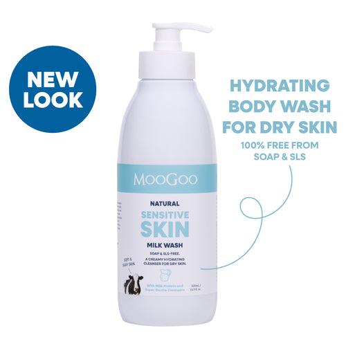 A bottle of MooGoo Natural Sensitive Skin Milk Wash with a pump dispenser, shown on a white background with promotional text and a blue 'NEW LOOK' badge. Hydrating body wash for dry skin. 100% free from soap & SLS. 