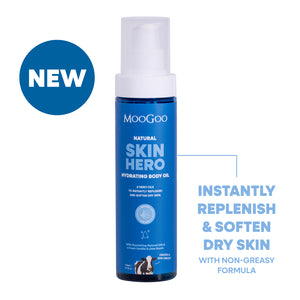 Moogoo Skin Hero hydrating body oil bottle with blue label on a white background with text instantly replenish & soften dry skin with non-greasy formula 