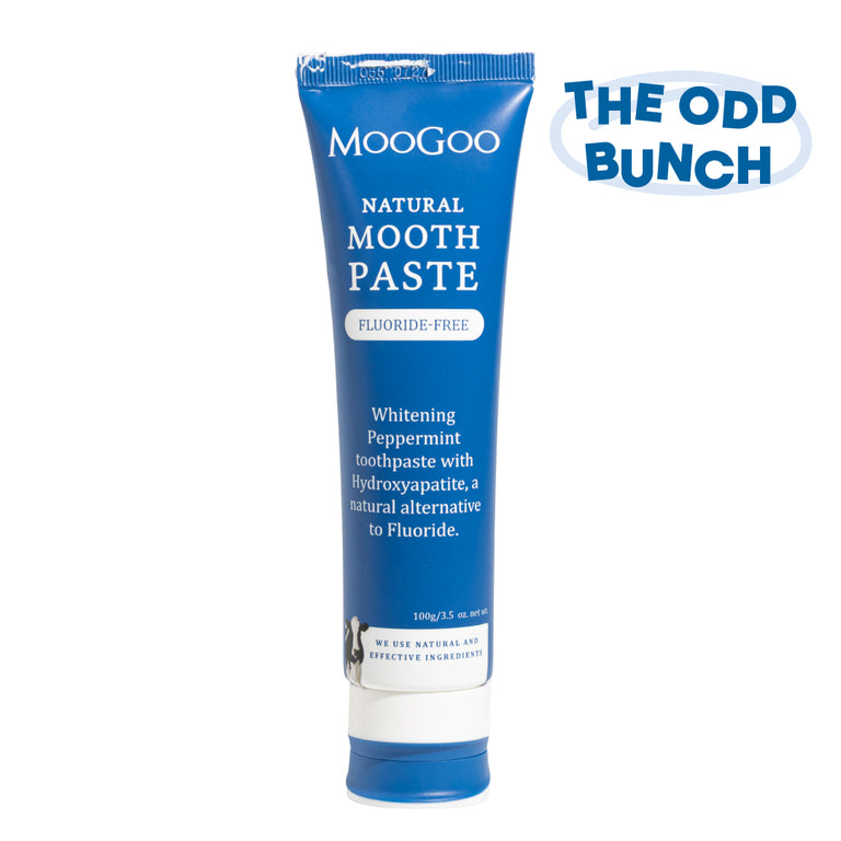 MooGoo Natural Moothpaste in a blue tube on a white background.