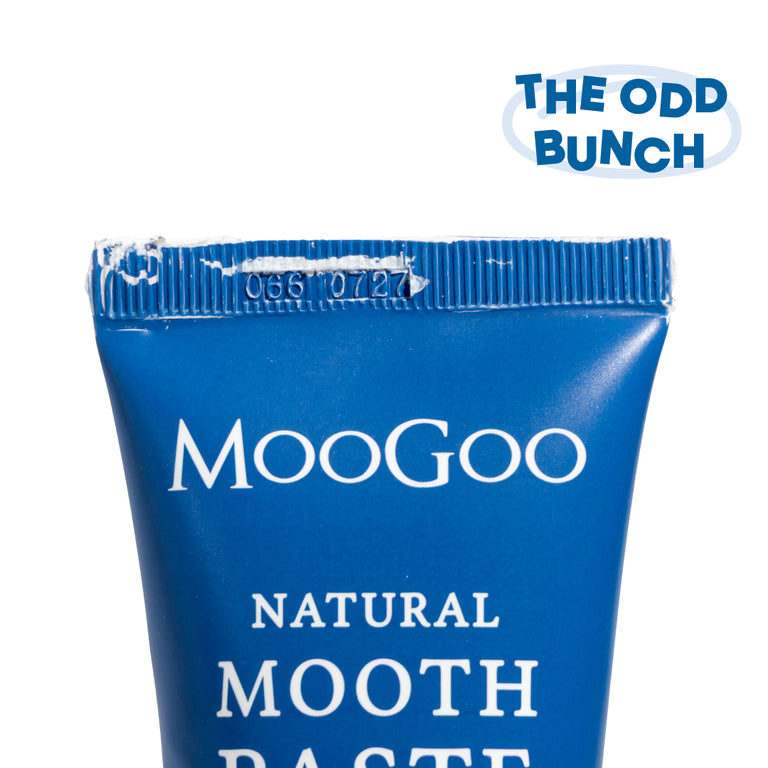 MooGoo Natural Moothpaste in a blue tube on a white background.