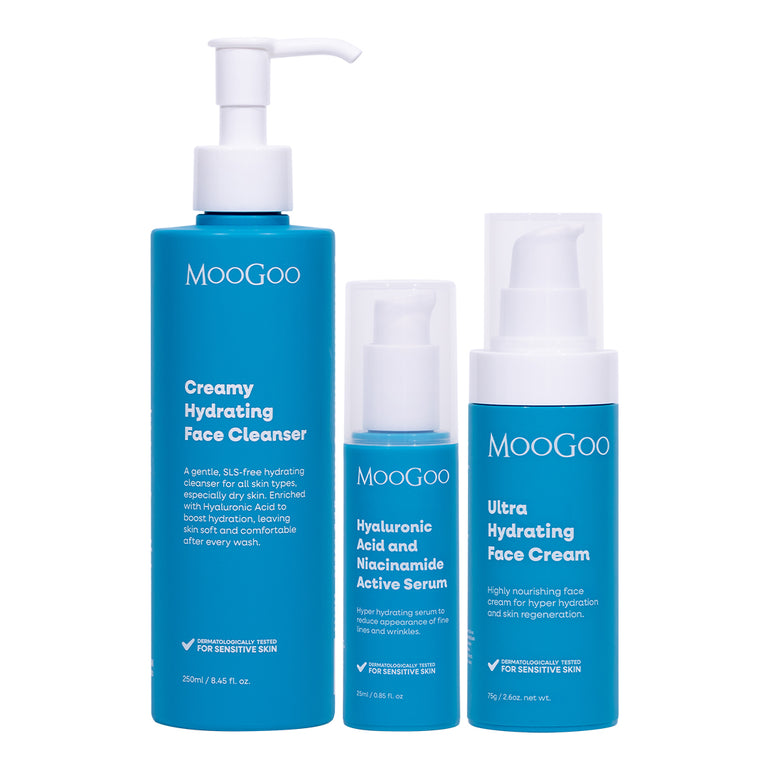 MooGoo Face Hydration Essentials Pack with three blue MooGoo skincare bottles on a white background: Creamy Hydrating Face Cleanser, Hyaluronic Acid and Niacinamide Active Serum and Ultra Hydrating Face Cream, natural skincare products designed to rehydrate, nourish and restore skin moisture barrier. 