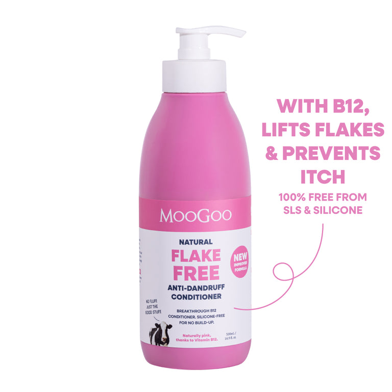 A pink MooGoo Flake Free Anti-Dandruff Conditioner bottle with a white pump dispenser, shown on a white background. Silicone and SLS free formula with jojoba and coconut oil to restore dry scalp, with Vitamin B12. 
