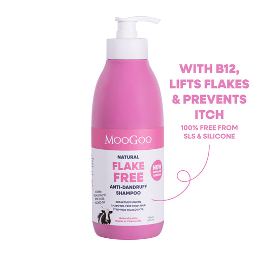 A pink bottle of MooGoo Natural Flake Free Anti-Dandruff Shampoo with a white pump dispenser, shown on a white background. Gentle SLS and silicone free cleanser to fight dandruff and soothe itchy, flaky scalp, with Vitamin B12. 