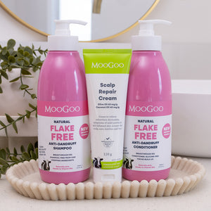 MooGoo Scalp Repair Pack on a basket, including natural pink flake free shampoo, conditioner and scalp cream for dandruff and seborrheic dermatitis, gentle on sensitive scalps