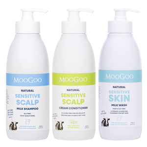 Three MooGoo Natural Sensitive Hair and Skin Care products on a white background: Milk Shampoo with a blue label, Cream Conditioner with a green label, and Milk Wash with a light blue label. 3 steps to complete a natural gentle shower routine. 