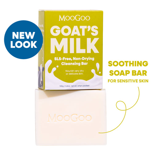 MooGoo Goat's Milk Soothing Cleansing Bar shown with its yellow-green packaging box and the bar itself on a white background, with text reading 'NEW LOOK' and 'SOOTHING SOAP BAR FOR SENSITIVE SKIN'. SLS free, to calm and hydrate delicate or irritated skin.