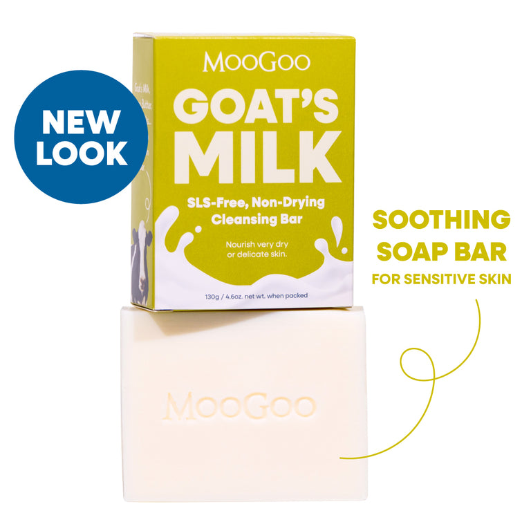 MooGoo Goat's Milk Soothing Cleansing Bar shown with its yellow-green packaging box and the bar itself on a white background, with text reading 'NEW LOOK' and 'SOOTHING SOAP BAR FOR SENSITIVE SKIN'. SLS free, to calm and hydrate delicate or irritated skin.