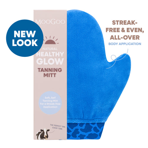 A blue MooGoo self-tanning mitt shown next to its beige packaging box on a white background. Self tanning tool for even application, reusable and lined to prevent staining hands. Streak-free & even, all-over body application. 