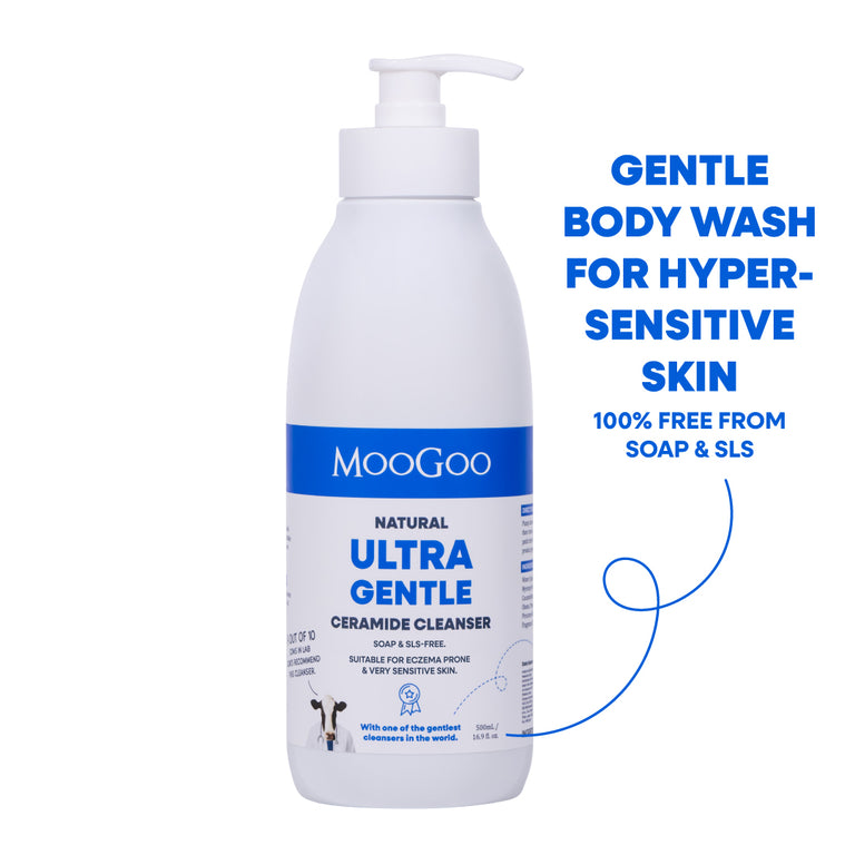 A white pump bottle of MooGoo Natural Ultra Gentle Ceramide Cleanser body wash, shown on a white background with blue promotional text on the right. For eczema prone and hypersensitive skin with ceramides to strengthen skin.