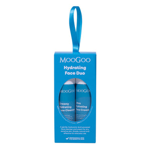 MooGoo Hydrating Face Duo gift set in a bright blue hanging box with one mini creamy hydrating face cleanser and one ultra hydrating face cream, visible through a circular window, on a plain white background.