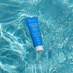 MooGoo Clear Zinc Sunscreen SPF 40 120g floating in a pool, a gentle zinc cream for UVA and UVB protection, kind to eczema prone skin. 